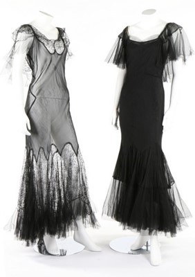 Lot 320 - A black pin-tucked chiffon bias cut couture...