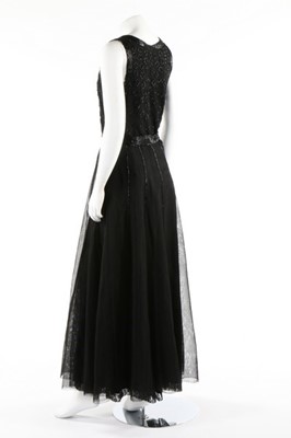 Lot 140 - A black moss crepe evening gown with sequined...