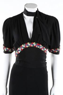 Lot 140 - A black moss crepe evening gown with sequined...