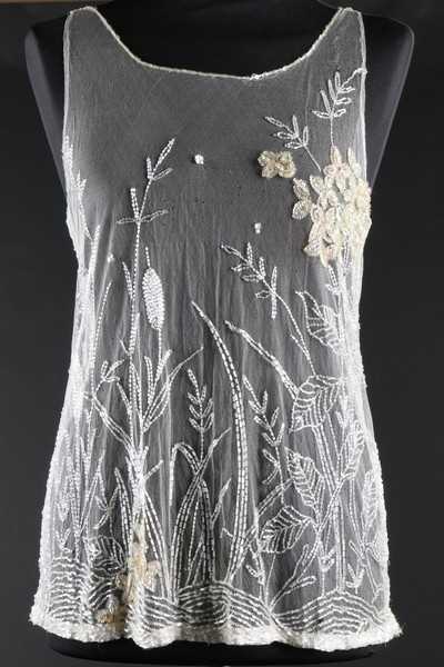 Lot 29 - A beaded and sequined white tulle bodice, late...