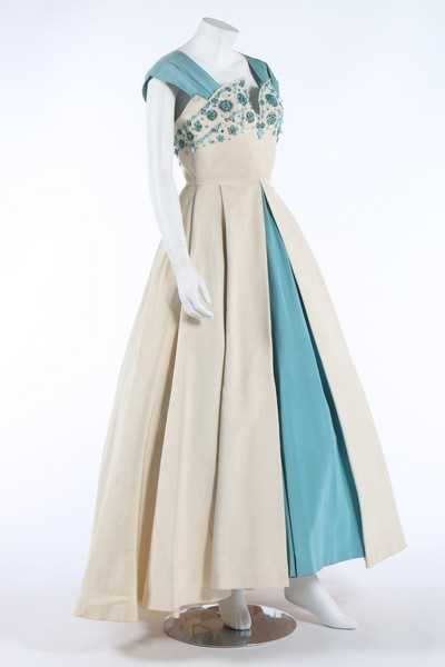 Lot 48 - A Norman Hartnell couture beaded ivory and...