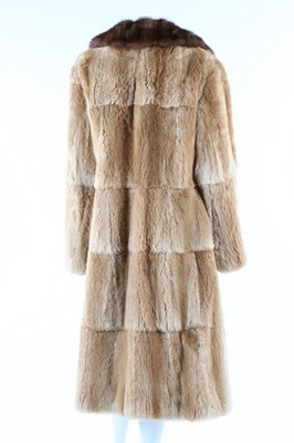 Lot 52 - Two fur coats, 1950s, one of tan fur probably...
