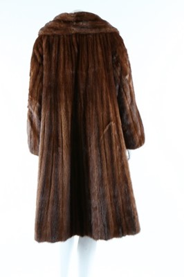Lot 52 - Two fur coats, 1950s, one of tan fur probably...