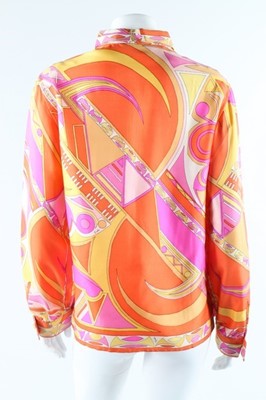 Lot 18 - Two Pucci printed silk blouses, late 1960s,...