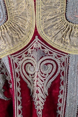 Lot 453 - An embroidered wine velvet surcoat, Ottoman...