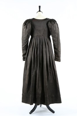 Lot 35 - A chocolate brown silk 'Quaker' dress, circa...
