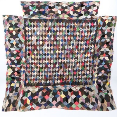 Lot 427 - A large tumbling block and harlequin patterned...