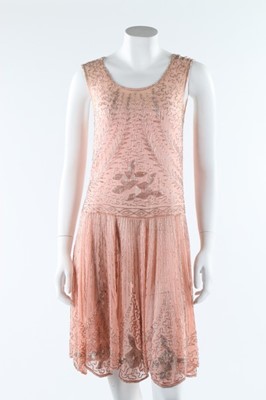 Lot 12 - A beaded pink muslin flapper dress, circa 1928,...