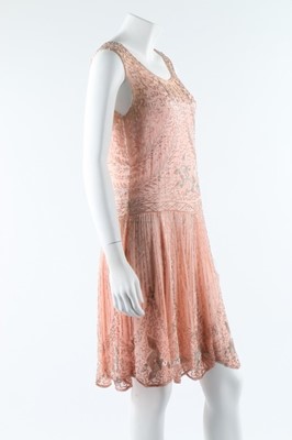 Lot 12 - A beaded pink muslin flapper dress, circa 1928,...