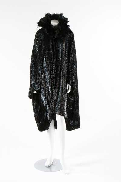 Lot 15 - A dramatic sequined bat-wing opera cape, 1920s,...