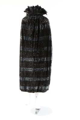 Lot 15 - A dramatic sequined bat-wing opera cape, 1920s,...