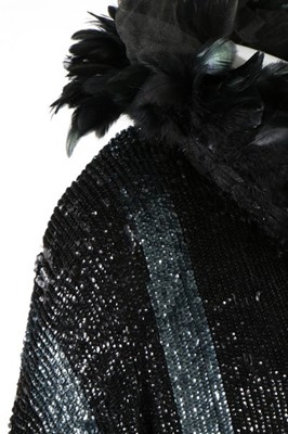 Lot 15 - A dramatic sequined bat-wing opera cape, 1920s,...