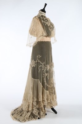 Lot 17 - An embroidered and appliqued lace bridal gown,...