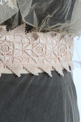 Lot 17 - An embroidered and appliqued lace bridal gown,...