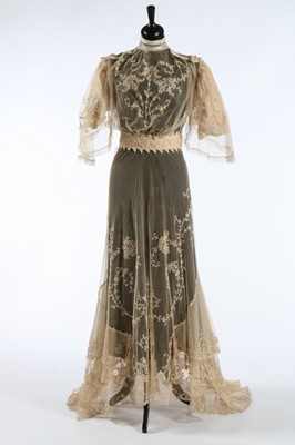 Lot 17 - An embroidered and appliqued lace bridal gown,...