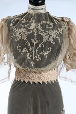 Lot 17 - An embroidered and appliqued lace bridal gown,...