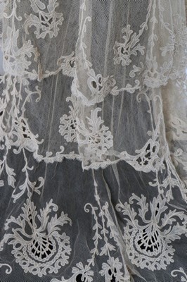 Lot 17 - An embroidered and appliqued lace bridal gown,...