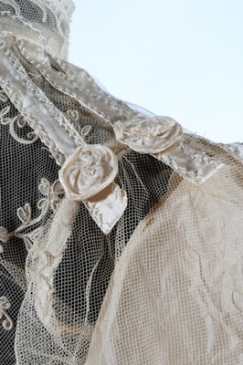 Lot 17 - An embroidered and appliqued lace bridal gown,...