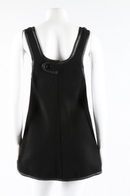 Lot 9 - A Courreges black wool mini-dress or tunic top,...