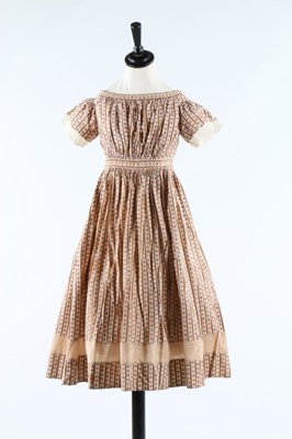 Lot 33 - Three printed cotton girl's dresses, one of...
