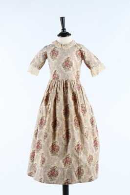 Lot 33 - Three printed cotton girl's dresses, one of...