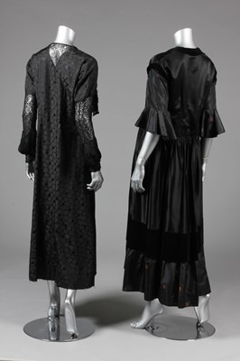 Lot 40 - Four black evening gowns, 1930s, of brocaded...