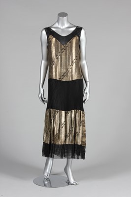 Lot 82 - A gold lamé cocktail dress, late 1920s-early...