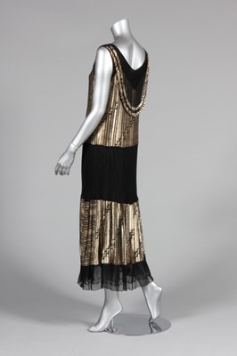 Lot 82 - A gold lamé cocktail dress, late 1920s-early...