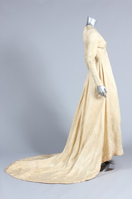 Lot 89 - A brocaded satin bridal gown, 1950, with long...