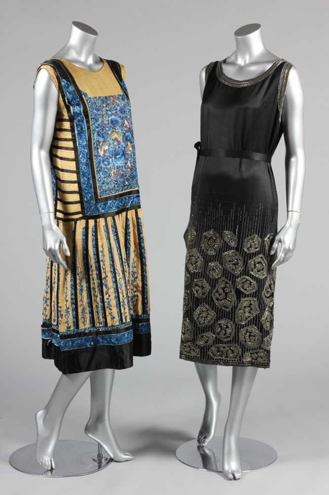Lot 113 - An embroidered black satin flapper dress,...