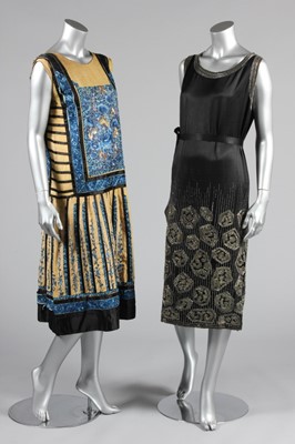 Lot 113 - An embroidered black satin flapper dress,...