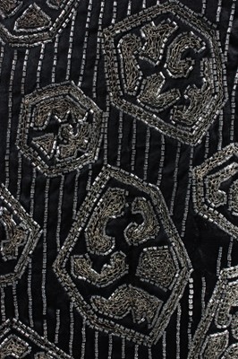 Lot 113 - An embroidered black satin flapper dress,...
