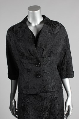 Lot 137 - A Nina Ricci couture black brocatelle dinner...