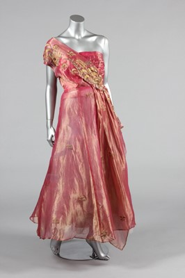 Lot 143 - A gold and ivory brocaded satin bridal gown,...