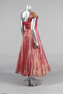 Lot 143 - A gold and ivory brocaded satin bridal gown,...