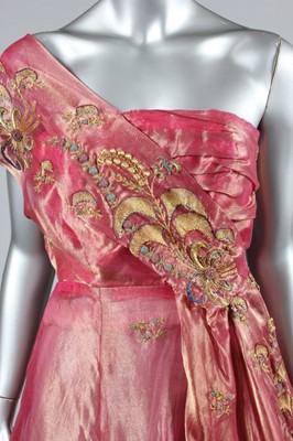 Lot 143 - A gold and ivory brocaded satin bridal gown,...