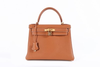 Lot 52 - An Hermès gold togo leather Kelly 28 bag,...