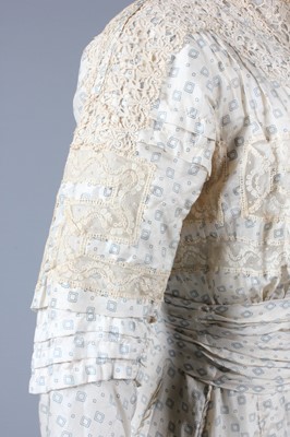 Lot 3 - A blue figured cotton summer gown, circa 1900,...