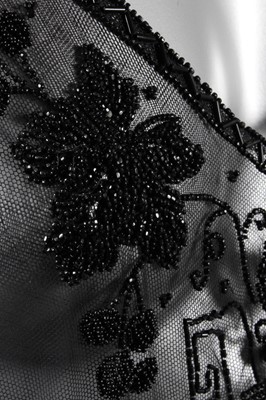 Lot 9 - A beaded black tulle tabard circa 1918, with...