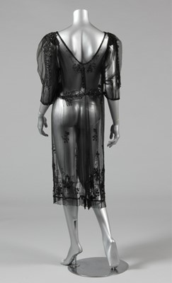 Lot 9 - A beaded black tulle tabard circa 1918, with...