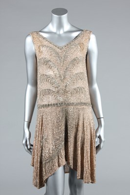 Lot 13 - A pale pink beaded muslin flapper dress, circa...