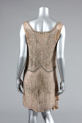 Lot 13 - A pale pink beaded muslin flapper dress, circa...