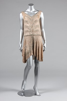 Lot 13 - A pale pink beaded muslin flapper dress, circa...
