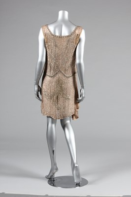 Lot 13 - A pale pink beaded muslin flapper dress, circa...