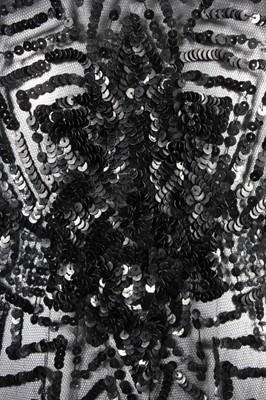 Lot 14 - A black sequined tabard circa 1918-20, the...