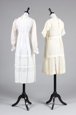 Lot 18 - Two muslin girl's dresses, circa 1918 and 1928,...