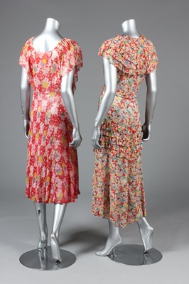 Lot 21 - Two floral printed chiffon dresses, early...