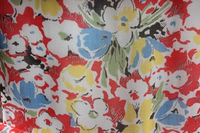 Lot 21 - Two floral printed chiffon dresses, early...