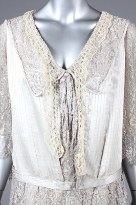 Lot 23 - A striped satin and silver lace evening gown,...