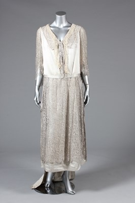 Lot 23 - A striped satin and silver lace evening gown,...